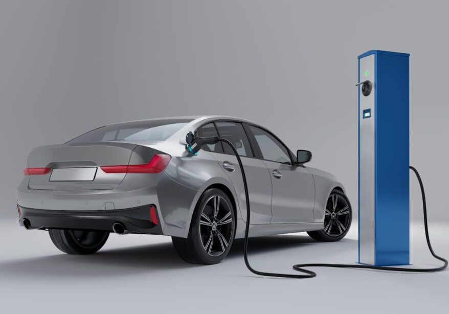 Silver EV charging at a station.